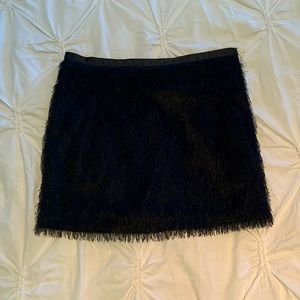 Fun and flirty black fuzzy/furry mini skirt from Bedo